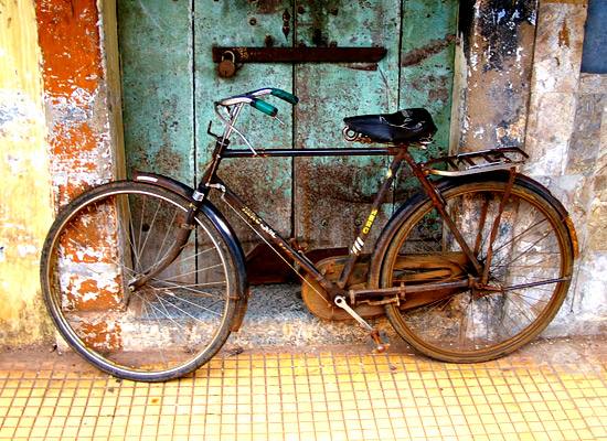 Bicycle against an old door
